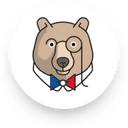 a circular badge with a bears face on it